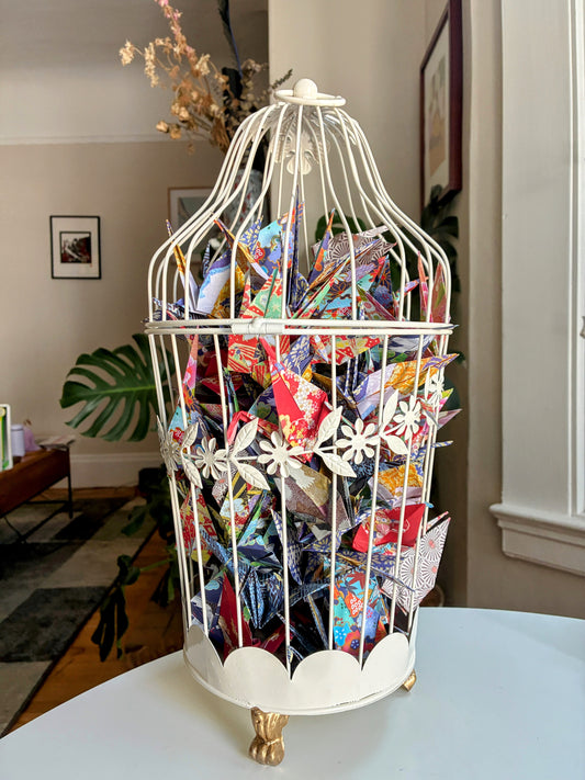 Senbazuru: Why the Caged Cranes Sing