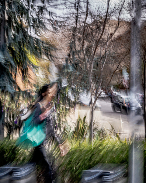 Woman Separated From the Street by Trees