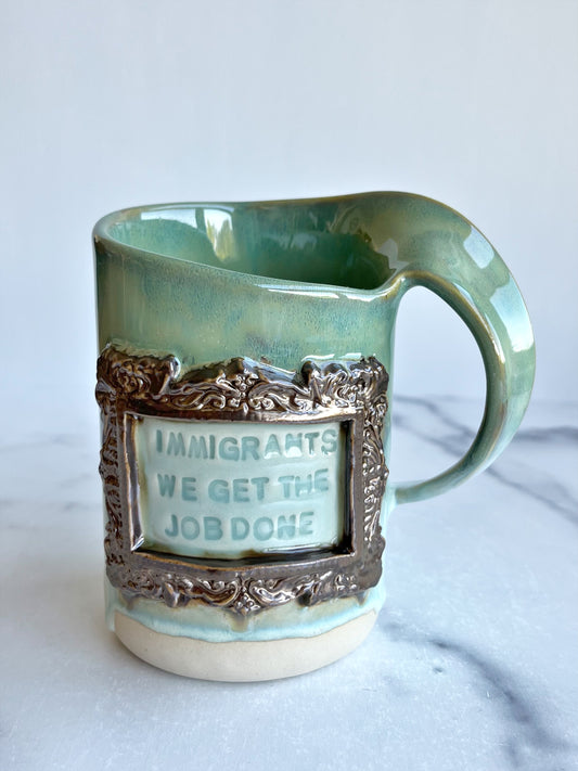 Immigrants, We Get The Job Done Spiral Mug.